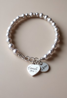 Personalized pearl bracelet with charms