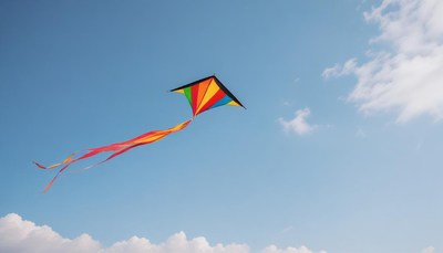 A colorful kite flies high in the sky