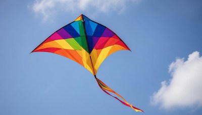 A colorful kite flies high in the sky
