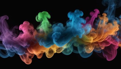 Colorful ink swirls in water on a black background