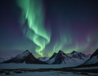 Northern lights illuminate snow-capped mountains at night