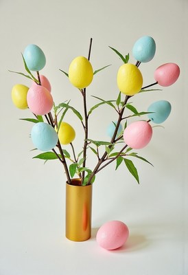 Colorful easter egg arrangement in a modern vase