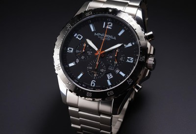 Luxury stainless steel chronograph watch on dark background