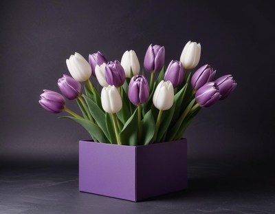 Purple and white tulips arranged in a decorative box