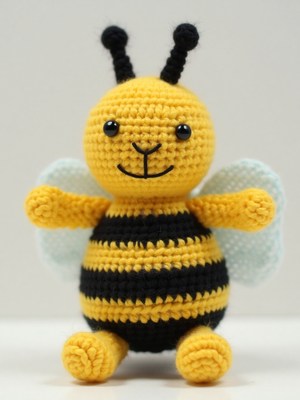 Crochet bee toy with vibrant colors and friendly smile