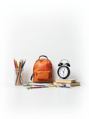 School essentials arranged on a plain background