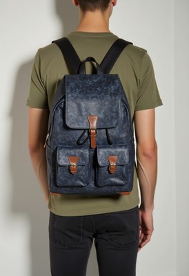 Stylish young man with backpack in casual setting