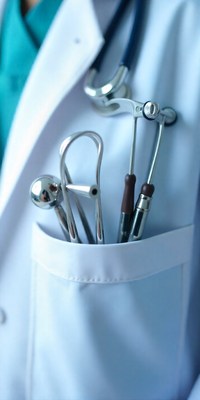 Medical professional with tools in pocket at clinic