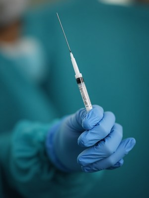 Holding syringe with needle for injection