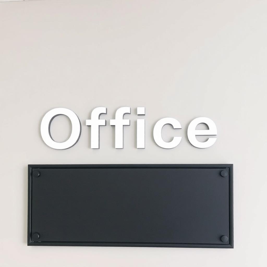 A white office sign with a black plaque below A white office sign with a black plaque below