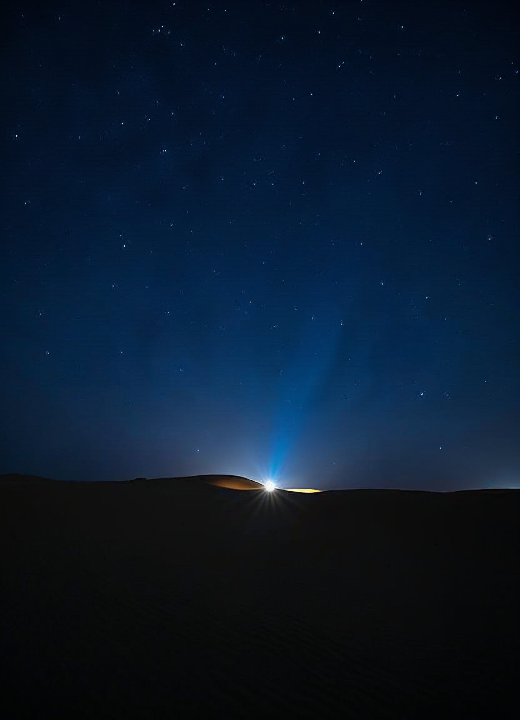 Night sky illuminated by distant lights on the horizon Night sky illuminated by distant lights on the horizon