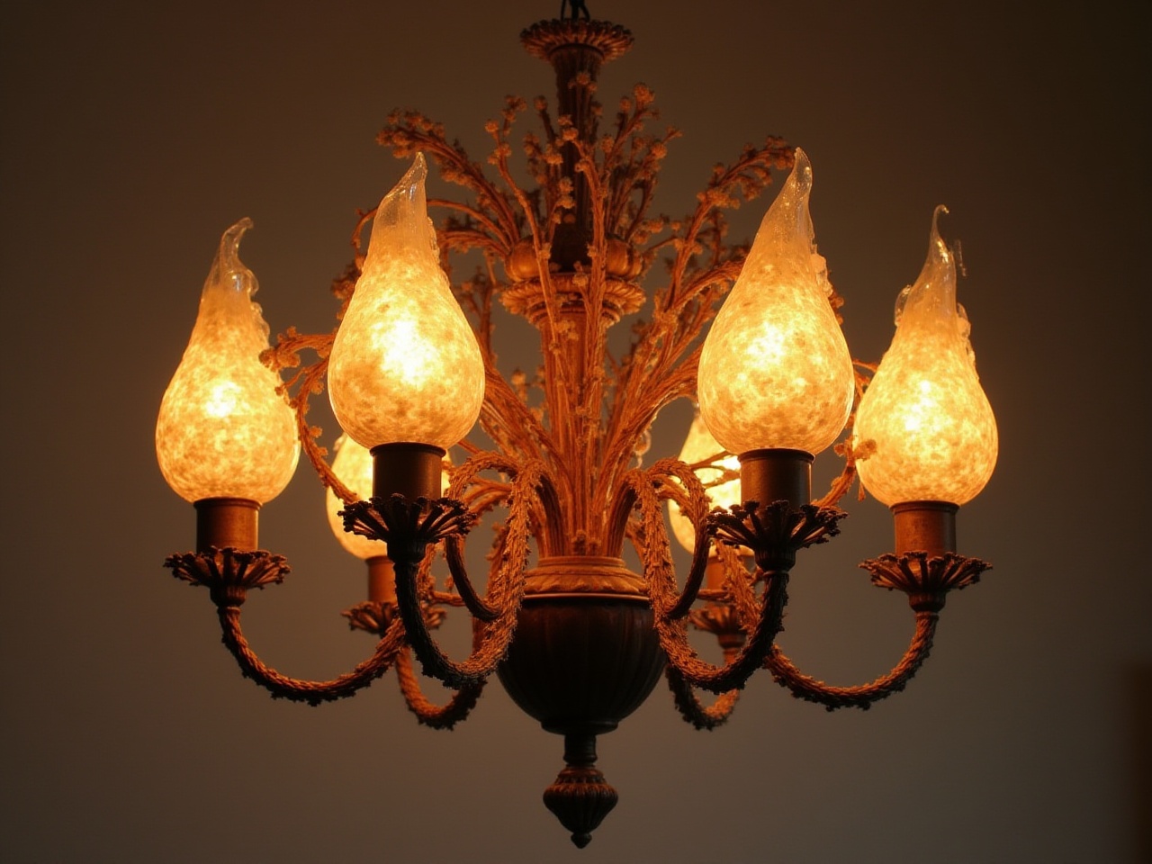 Elegant chandelier with warm light in cozy interior space Elegant chandelier with warm light in cozy interior space