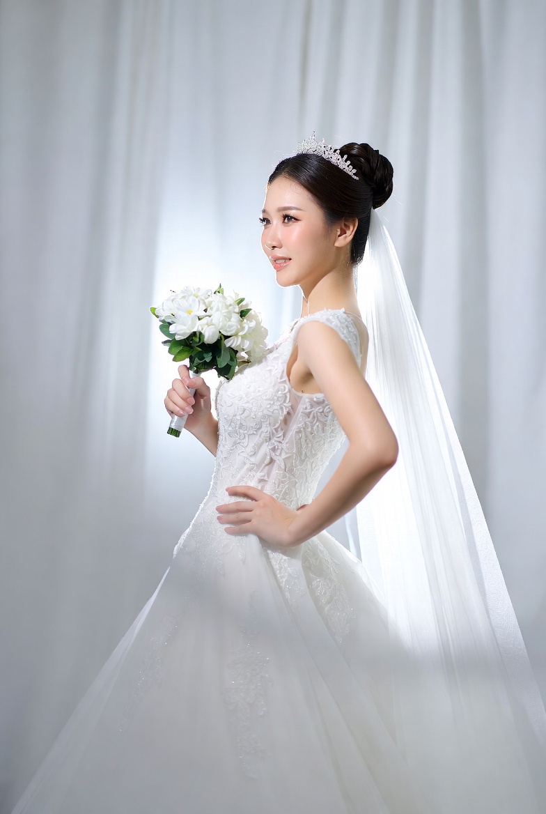 Bridal portrait with bouquet in soft light setting Bridal portrait with bouquet in soft light setting