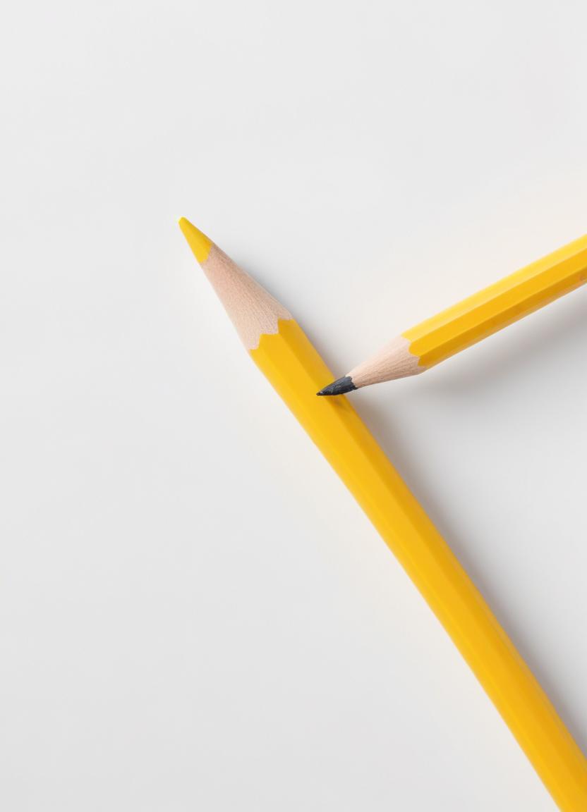 Two yellow pencils on a white surface Two yellow pencils on a white surface