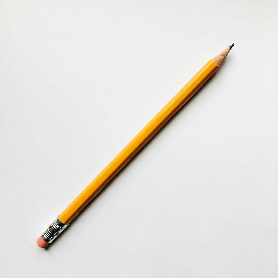 Simple yellow pencil on white background Simple yellow pencil on white background
