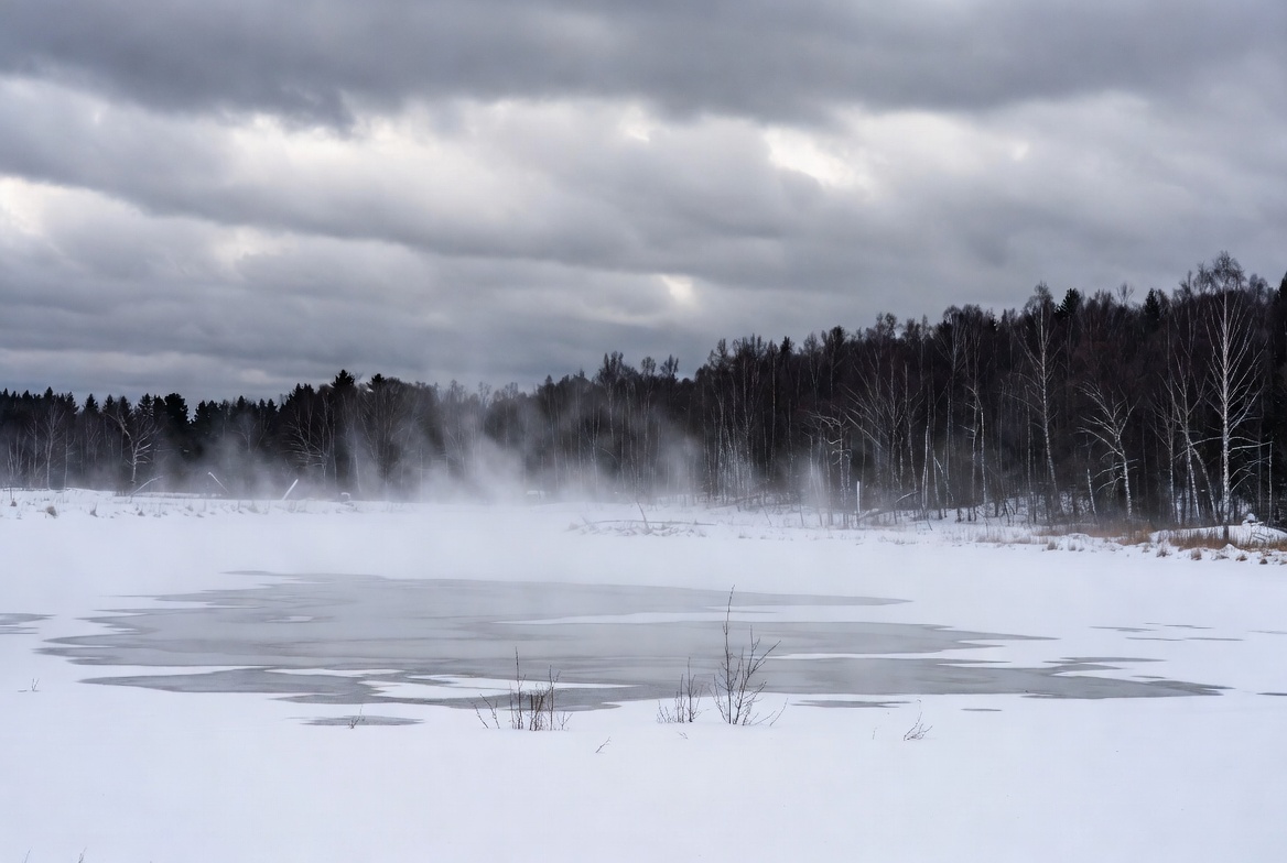 Winter mist over frozen lake Winter mist over frozen lake