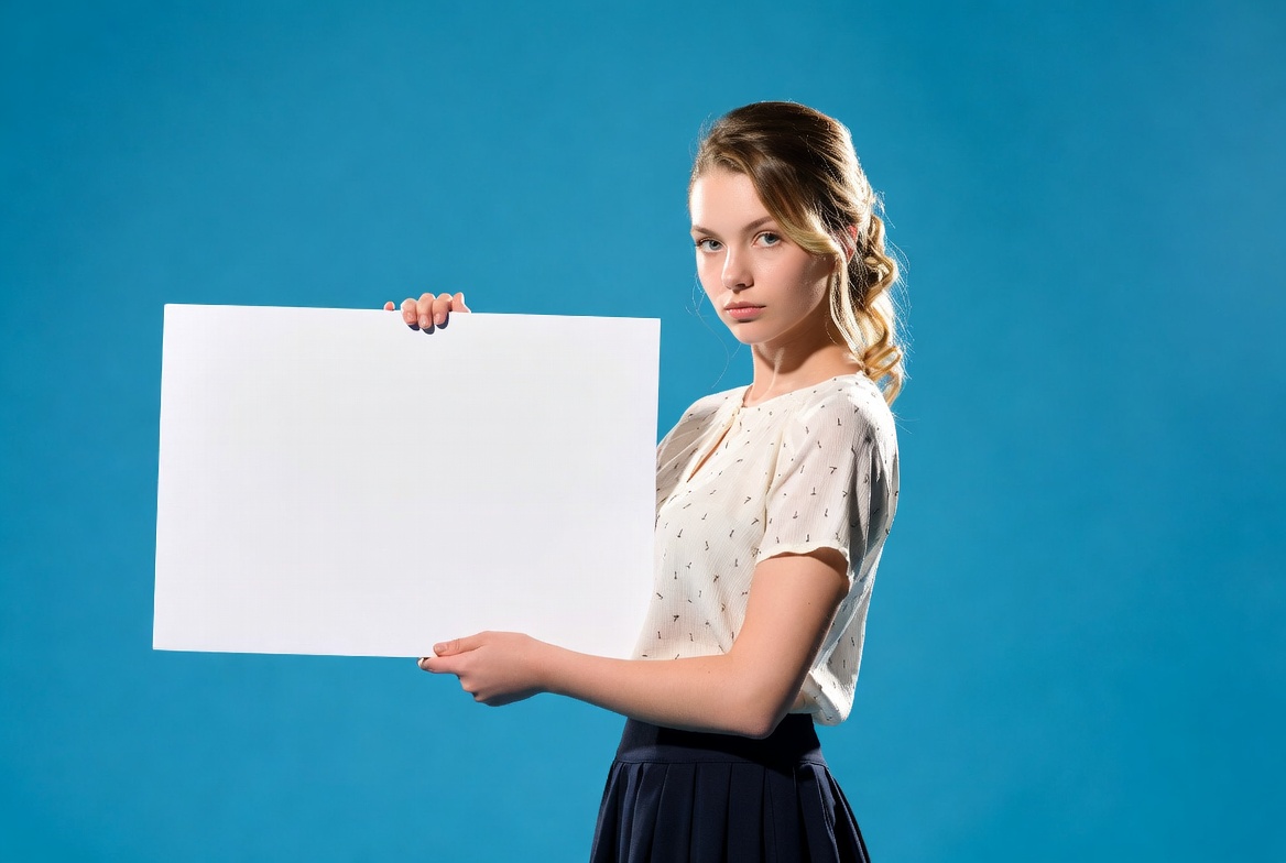 Woman holding blank sign indoors Woman holding blank sign indoors