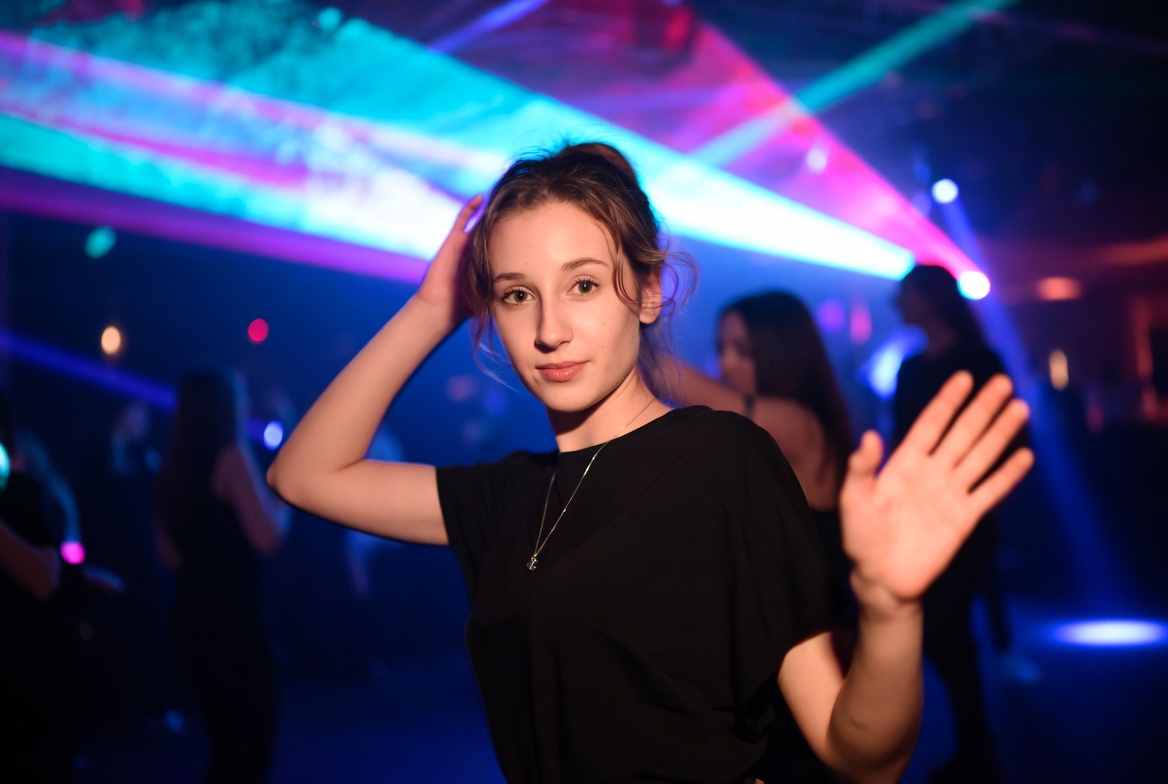 Young woman dancing at night club Young woman dancing at night club