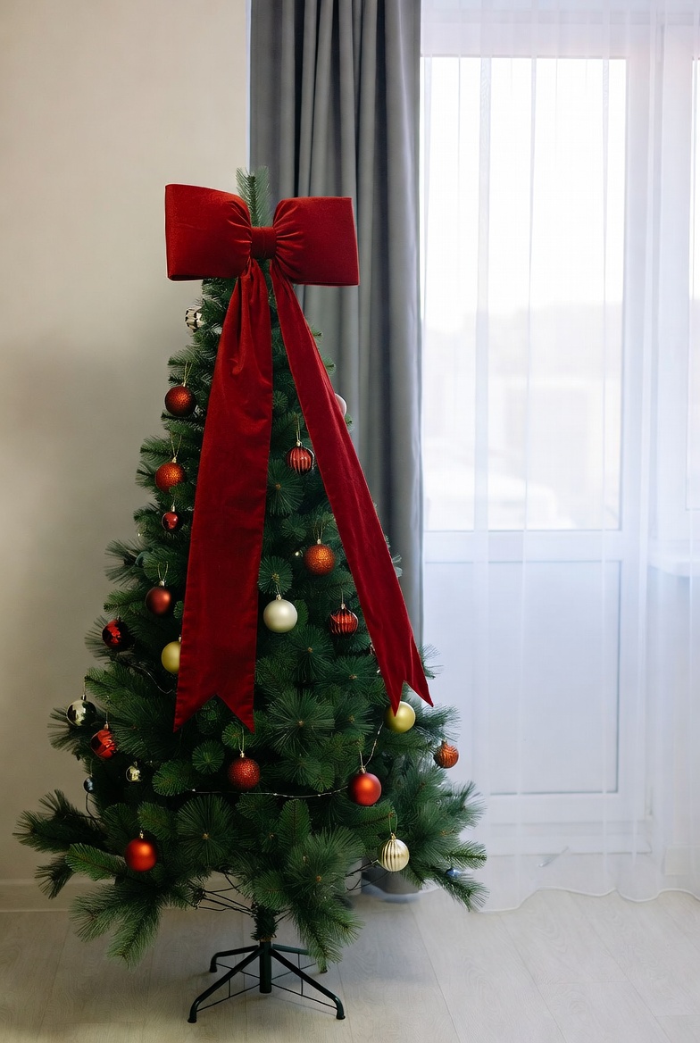 Festive christmas tree with red bow Festive christmas tree with red bow