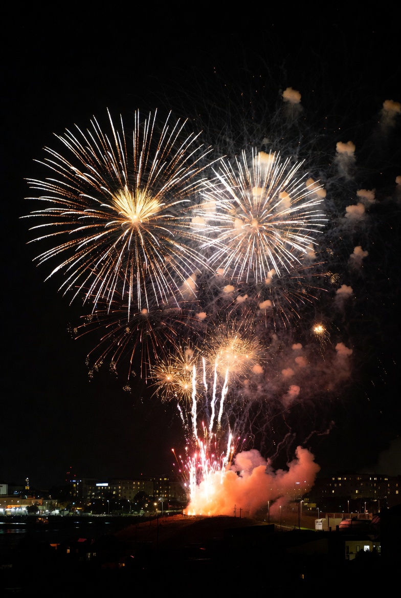Fireworks display over city skyline Fireworks display over city skyline