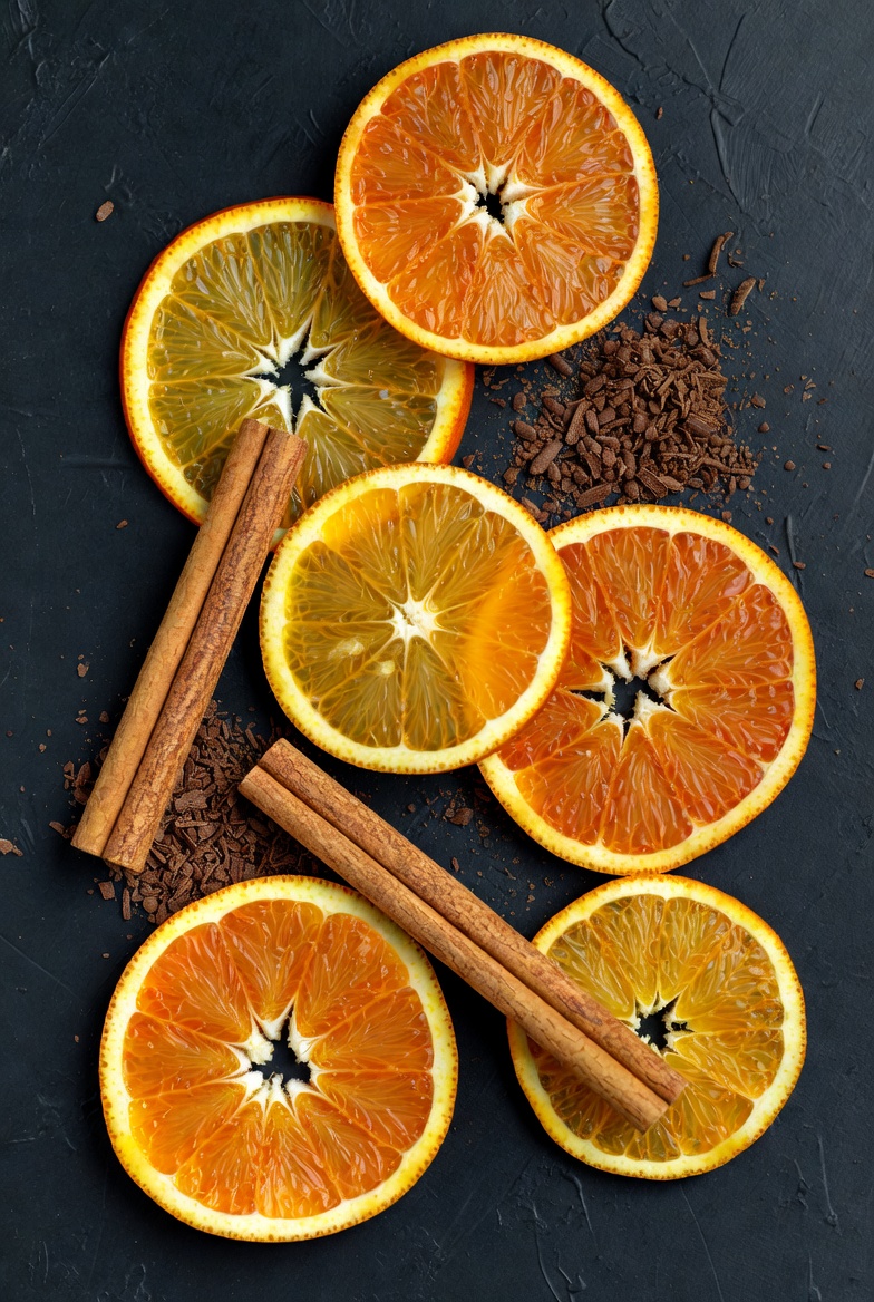 Citrus and spice arrangement on dark surface Citrus and spice arrangement on dark surface
