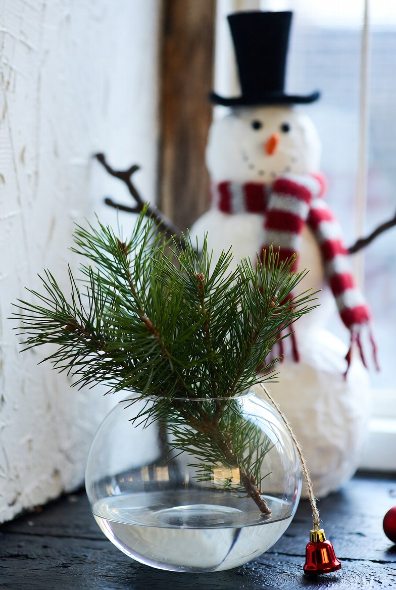Festive decor with snowman and greenery Festive decor with snowman and greenery