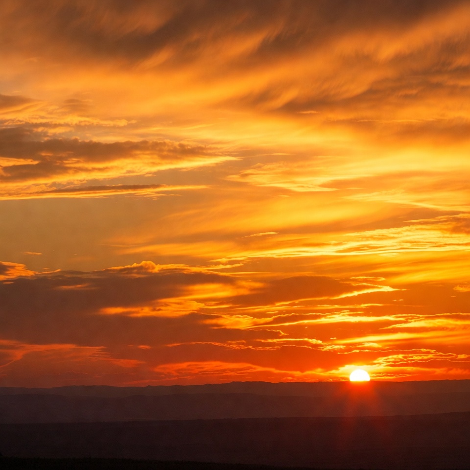 Sunset over the horizon with clouds Sunset over the horizon with clouds
