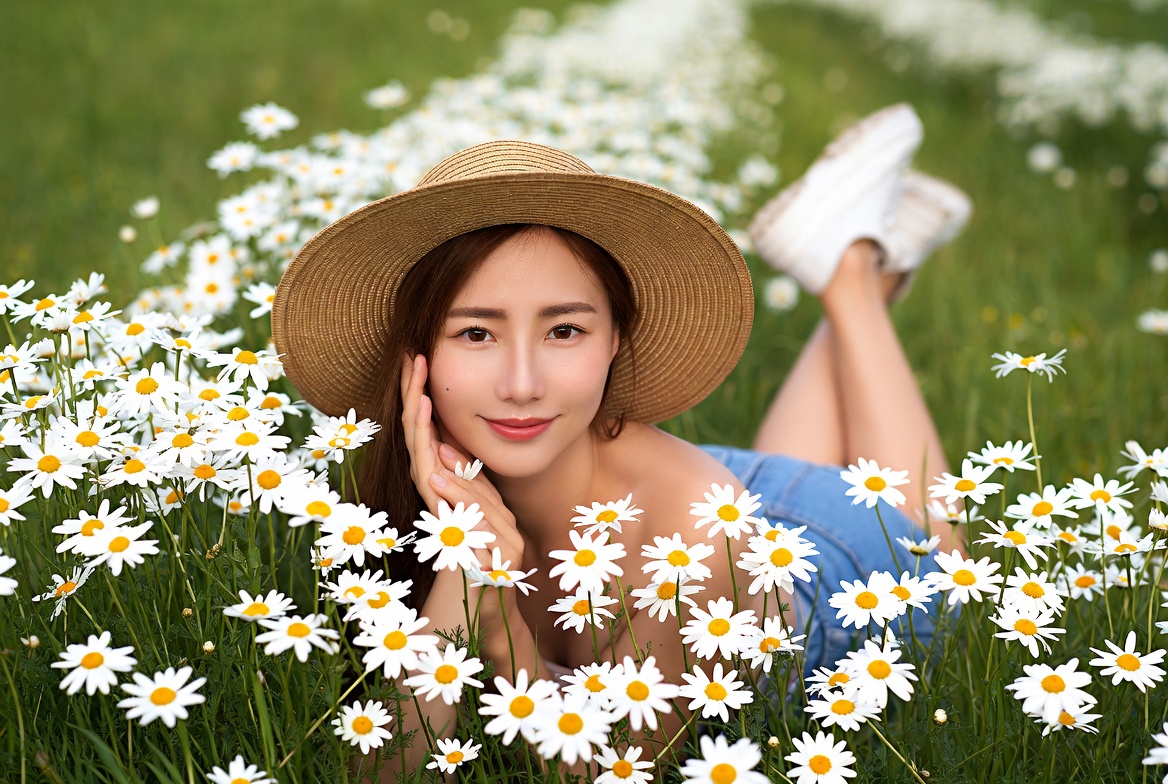 Woman in flower field relaxing Woman in flower field relaxing