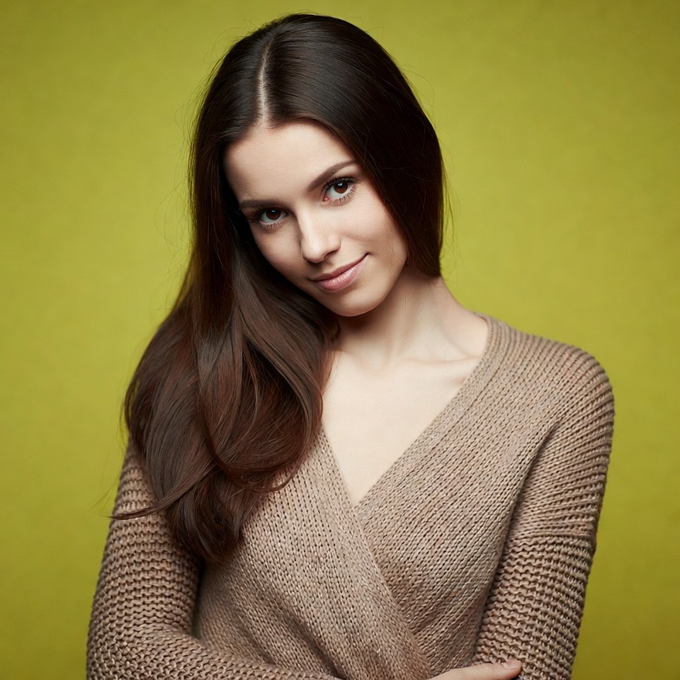 Young woman poses against green background Young woman poses against green background