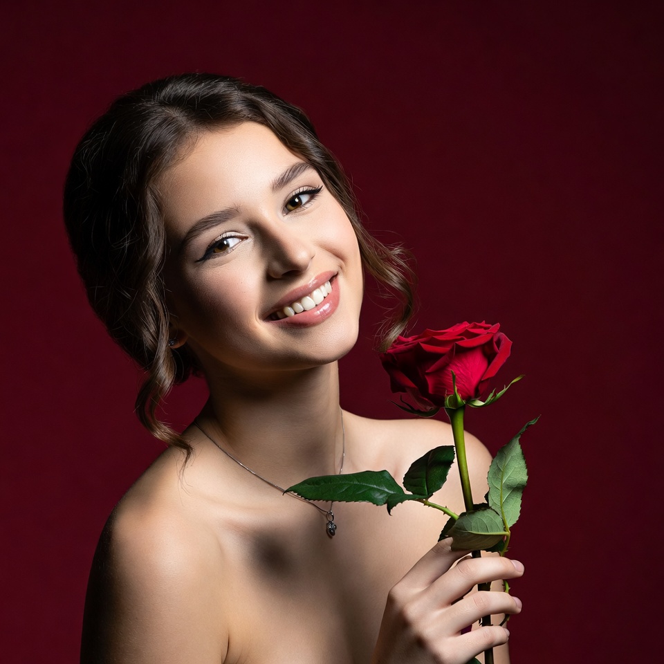 Woman holding a red rose Woman holding a red rose