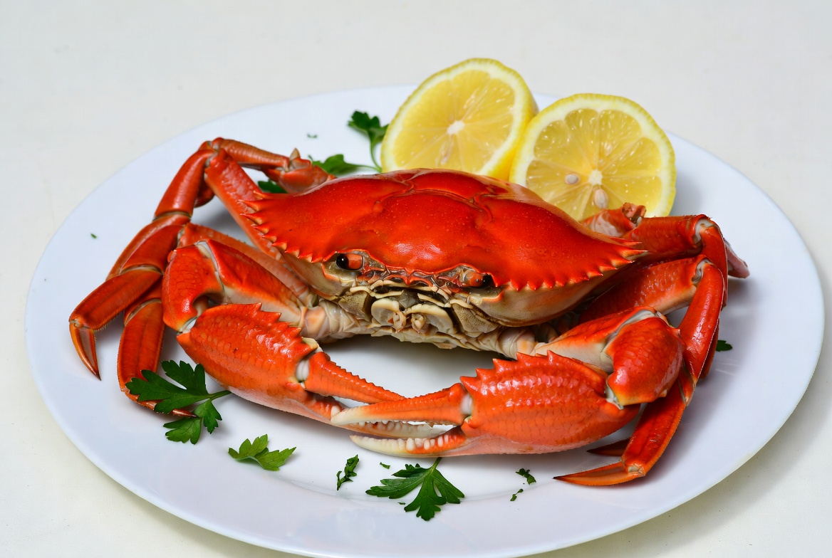 Fresh crab served with lemon slices Fresh crab served with lemon slices