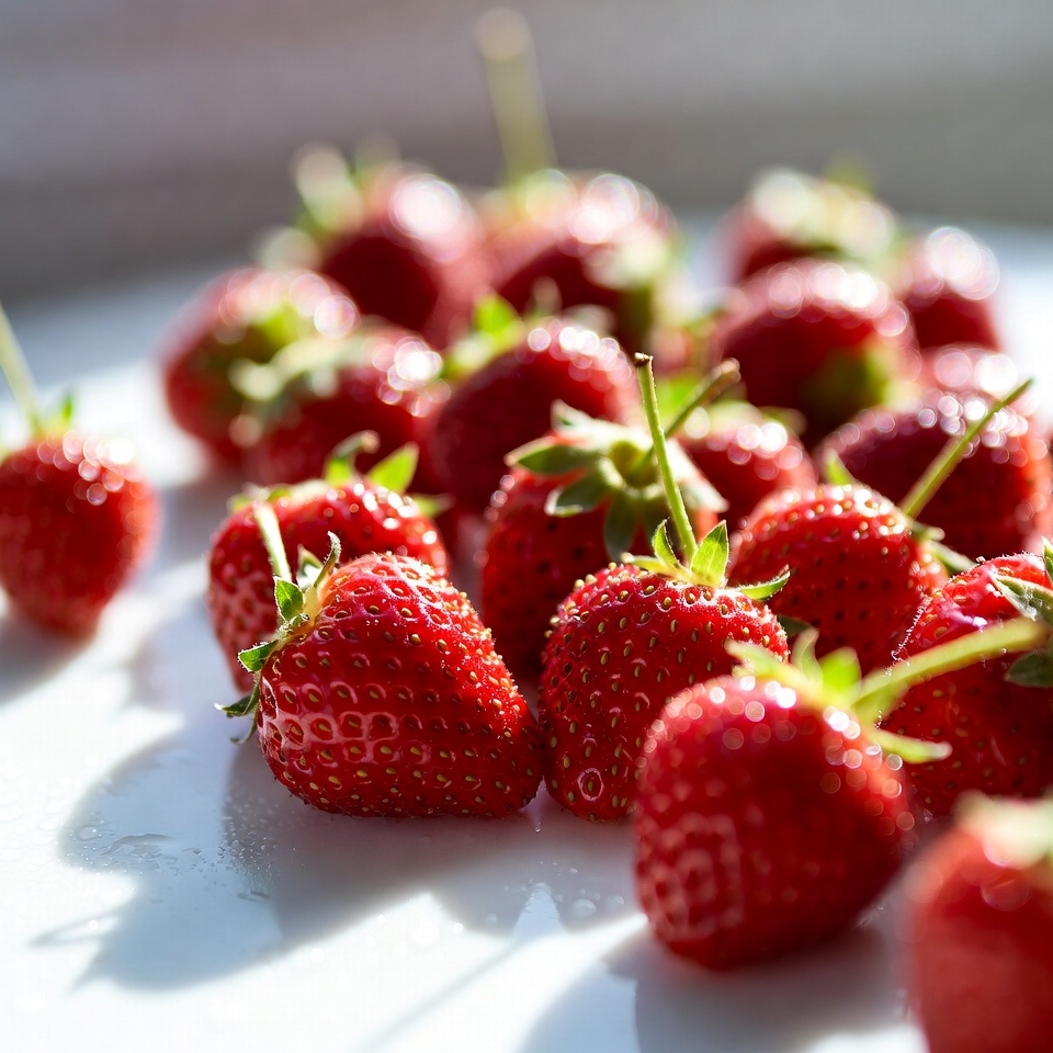Fresh strawberries on white plate Fresh strawberries on white plate