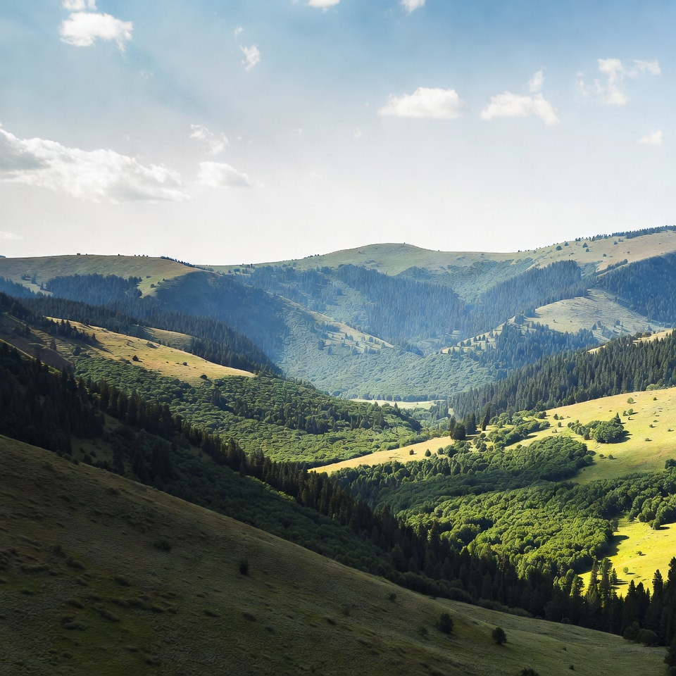 Green hills under blue sky in daytime Green hills under blue sky in daytime