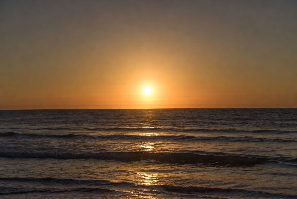 Sunset over the ocean horizon Sunset over the ocean horizon