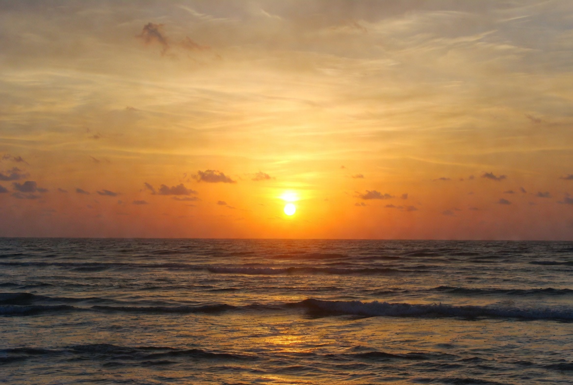 Sunset over the ocean waves Sunset over the ocean waves