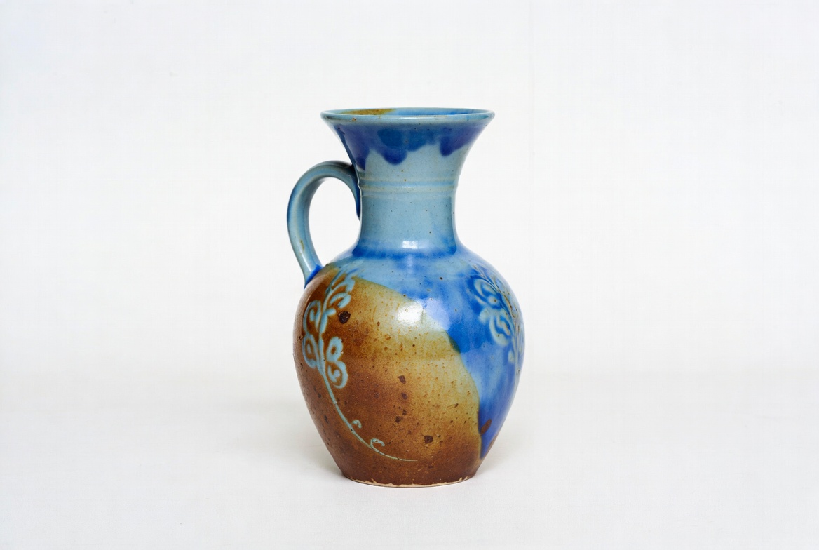 Decorative ceramic pitcher in blue and brown Decorative ceramic pitcher in blue and brown