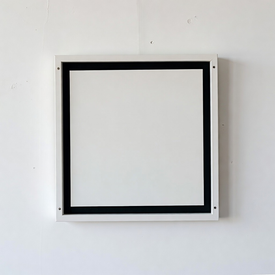 Empty frame on a white wall Empty frame on a white wall