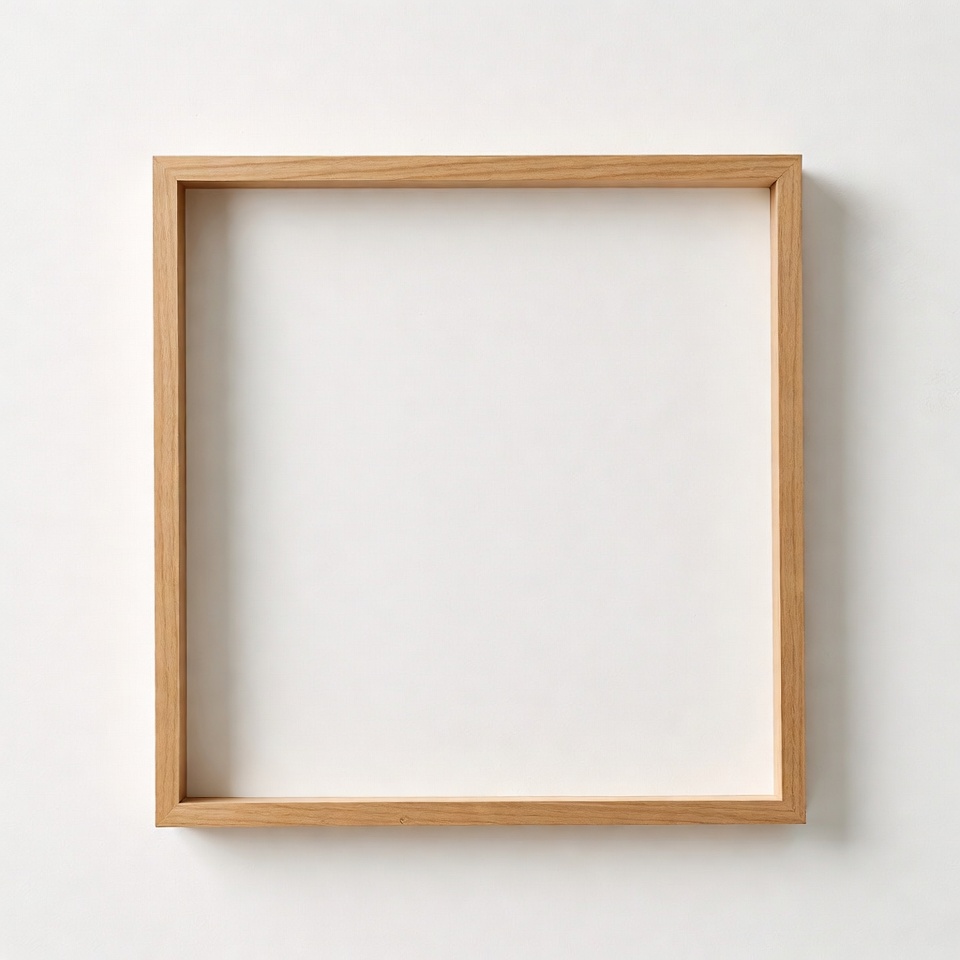 Empty wooden frame on white wall Empty wooden frame on white wall