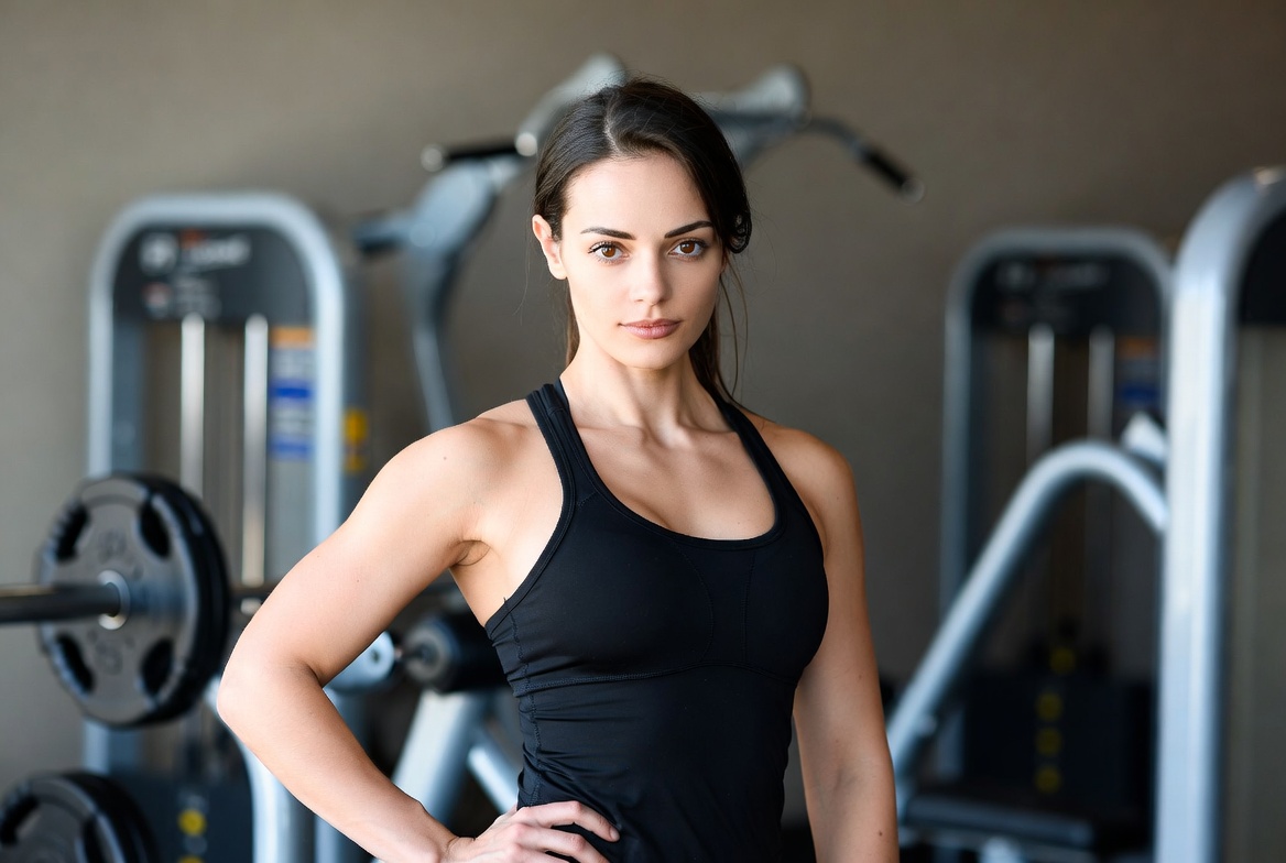 Woman posing in gym training Woman posing in gym training