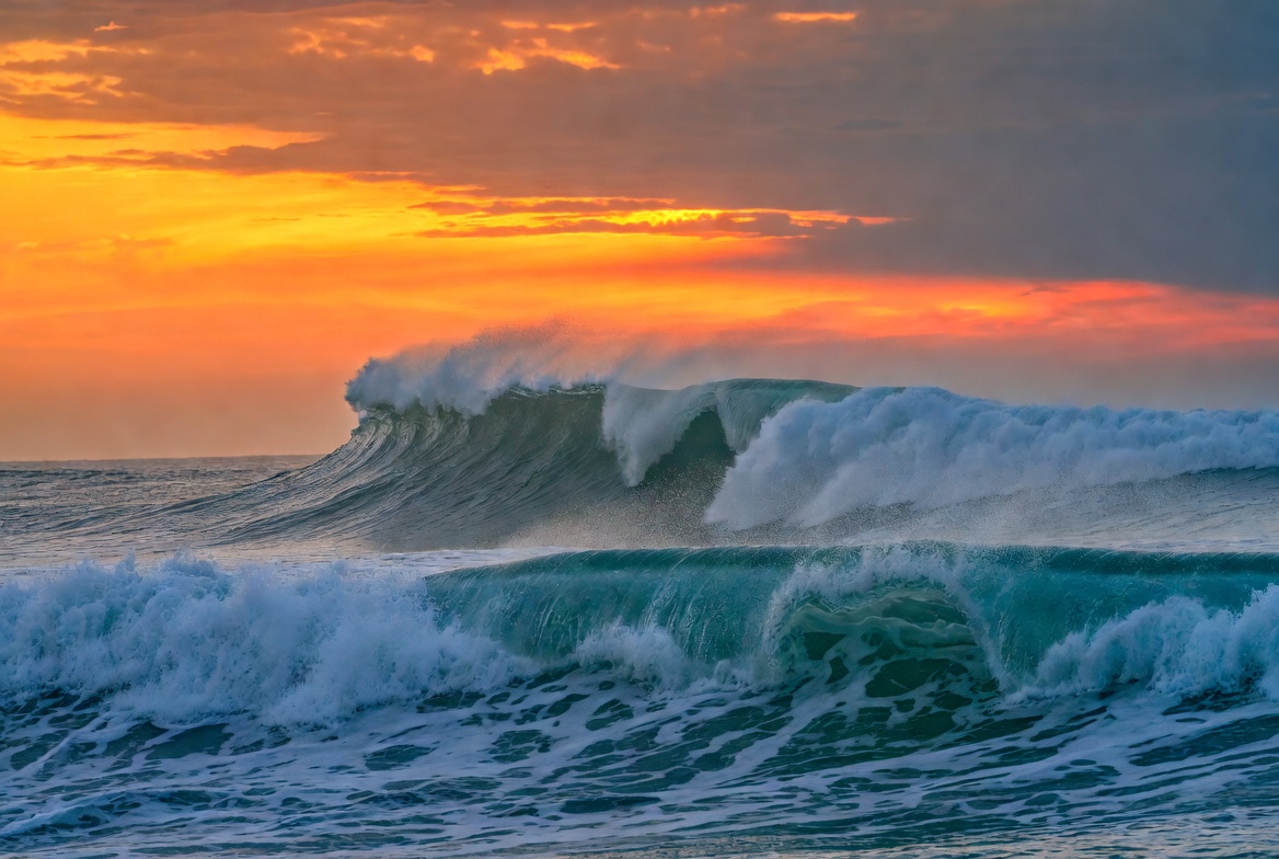 Waves crashing at sunset Waves crashing at sunset