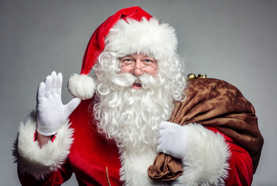 Santa claus waving with a bag Santa claus waving with a bag