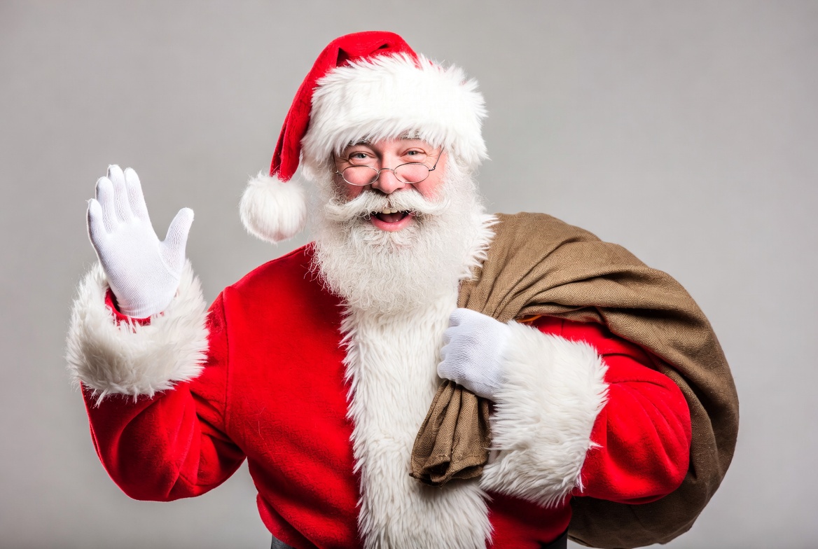 Santa waves with his sack Santa waves with his sack
