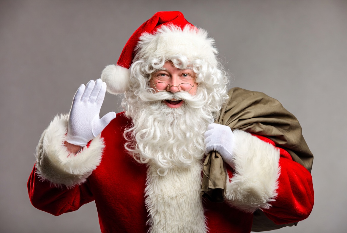 Santa claus waving with sack Santa claus waving with sack