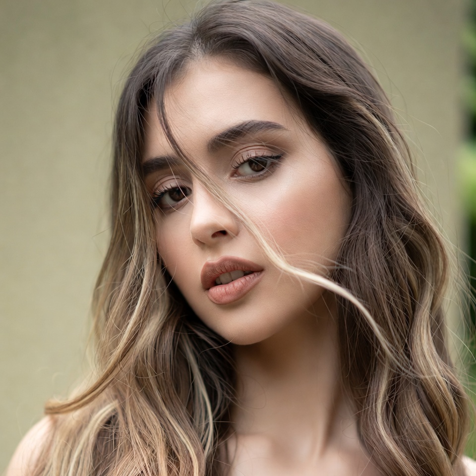 Beautiful portrait of young woman in sunlight Beautiful portrait of young woman in sunlight