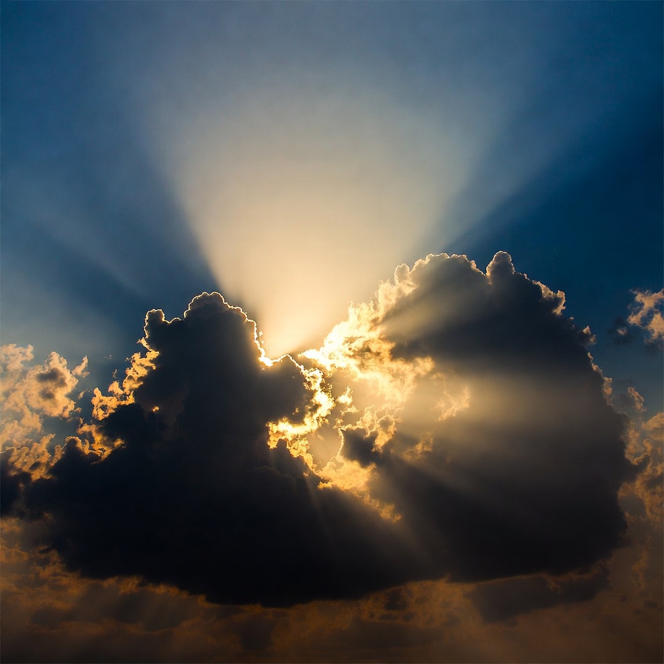 Rays of light shine through clouds Rays of light shine through clouds