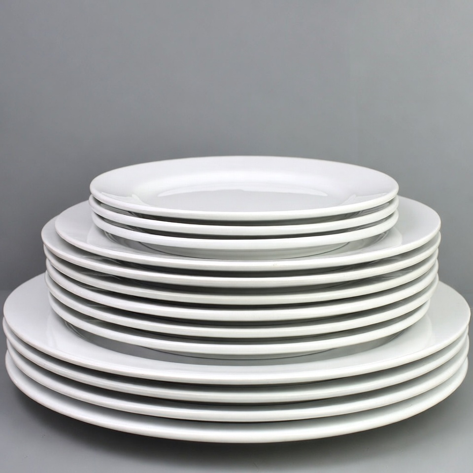 Stacked white plates in display Stacked white plates in display