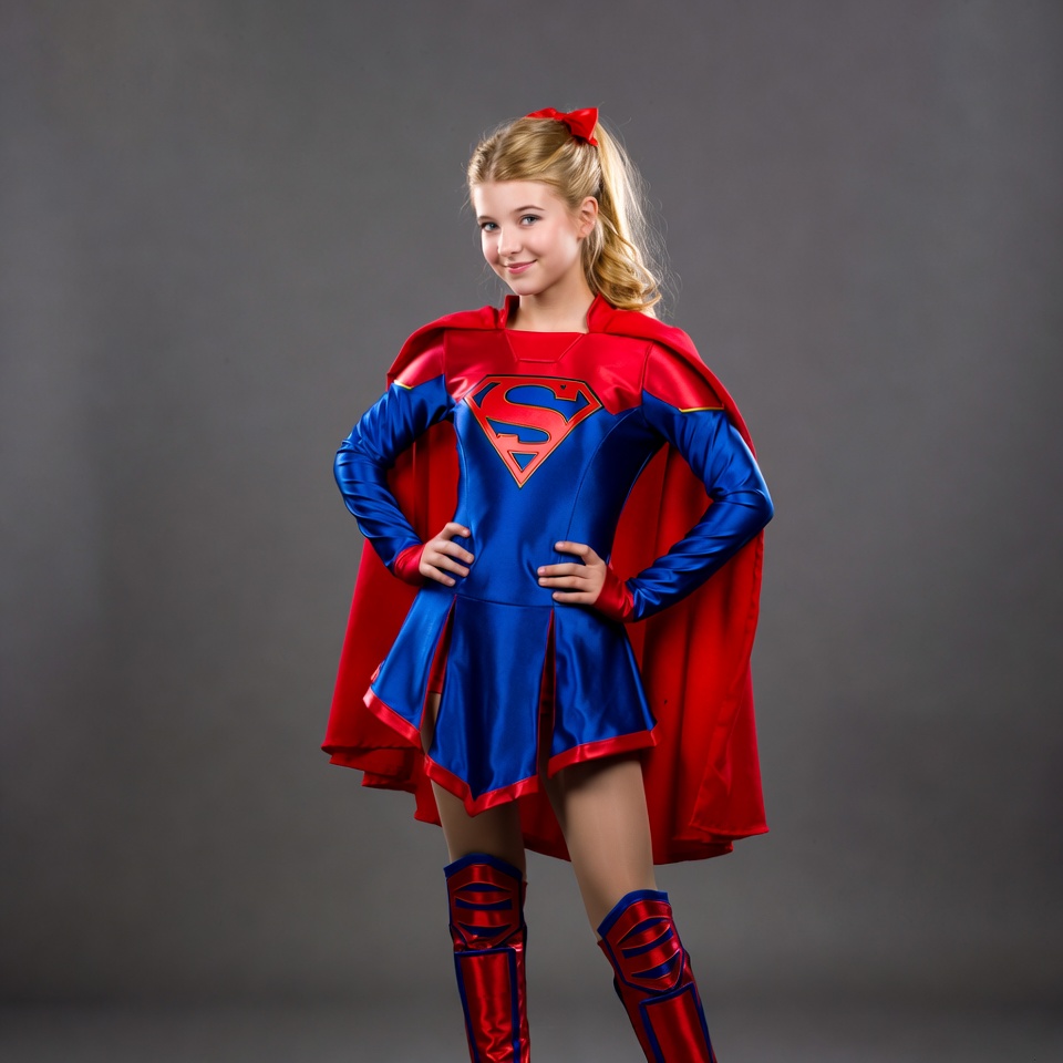Girl in superhero costume posing for camera Girl in superhero costume posing for camera