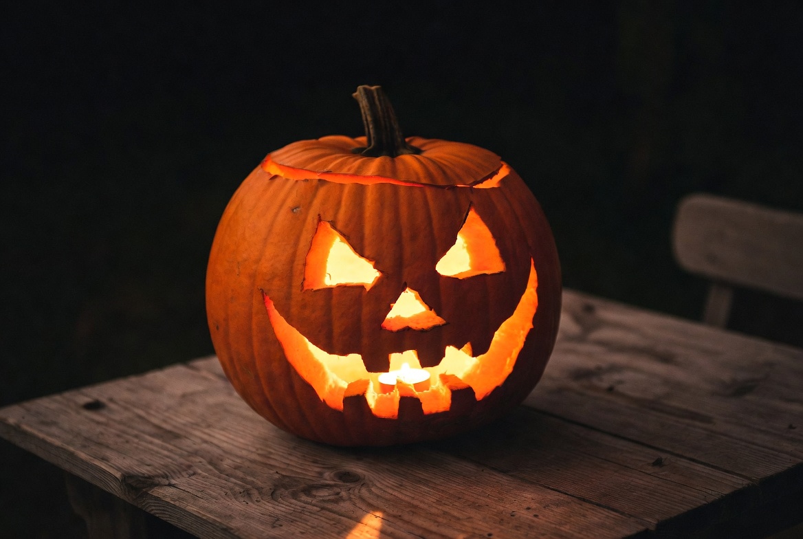 Halloween pumpkin on wooden table Halloween pumpkin on wooden table