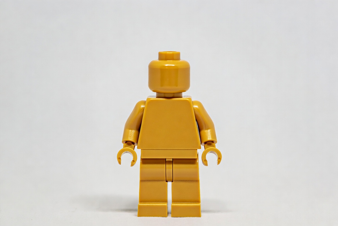 Yellow lego figure standing still Yellow lego figure standing still