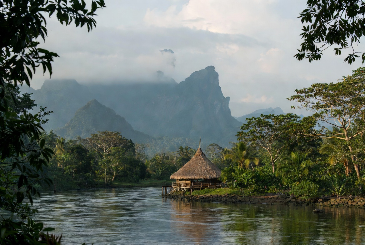 Hut by the river near mountains Hut by the river near mountains